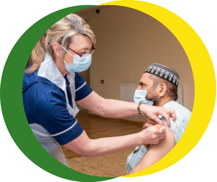 A health and care professional delivers a vaccination to a patient