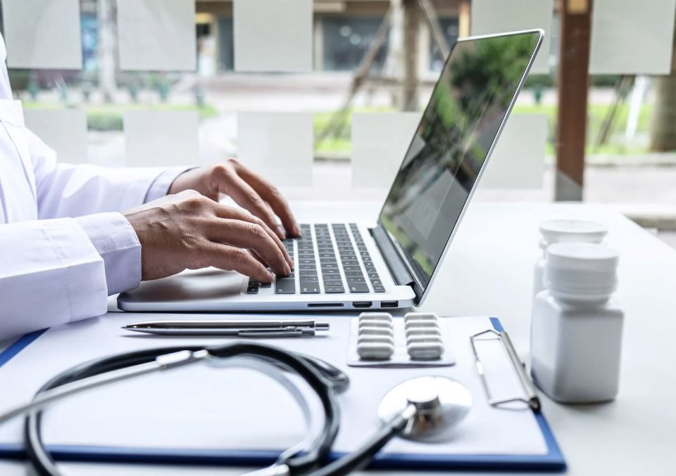 Doctor working on a laptop