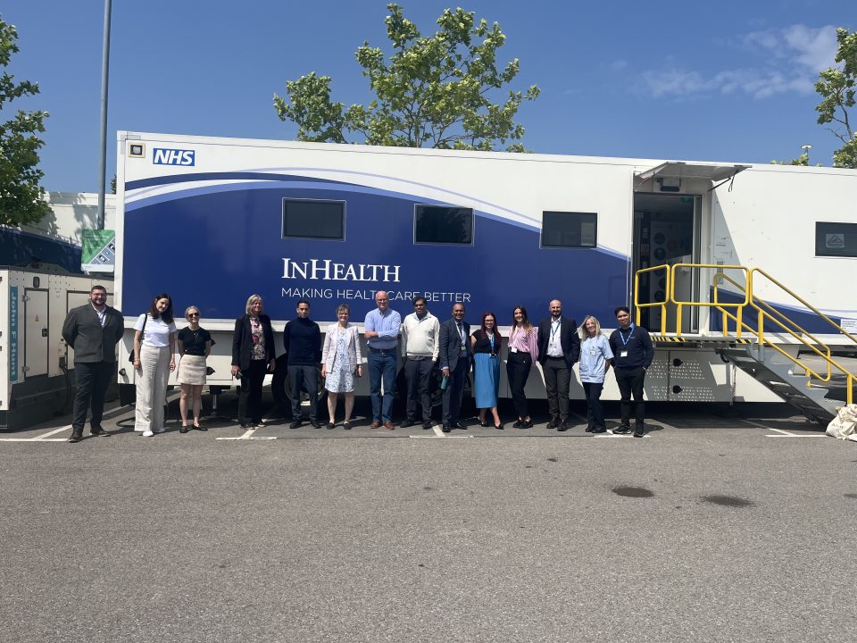 Staff stood outside a lung cancer screening mobile unit