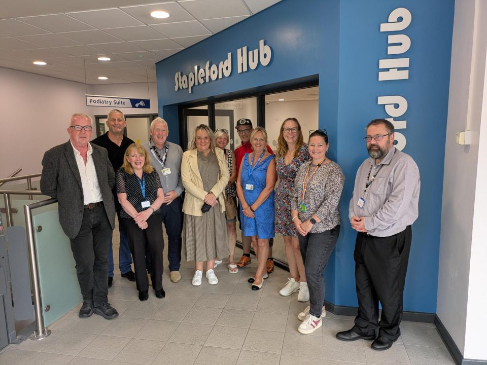 Photo of representatives from the following organisations standing outside the entrance to Stapleford Hub: CHP, FES, Greater Nottingham LIFTCo, NHS Nottingham and Nottinghamshire ICB, Nottingham Healthcare NHS Foundation Trust and Broxtowe Borough Council